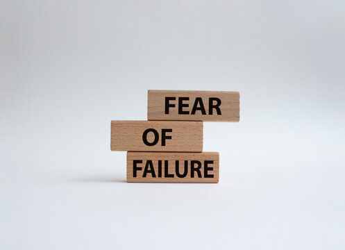 Fear of failure symbol. Concept words Fear of failure on wooden blocks. Beautiful gwhite background. Business and Fear of failure concept. Copy space.