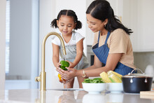 Kitchen, Mother And Child Washing Vegetable To Cook Dinner, Lunch Or Breakfast Together At House. Happiness, Bonding And Mom Cleaning A Green Pepper Before Cooking Food With Girl Kid In Family Home.
