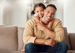 © Beaunitta V W/peopleimages.com - Happy, father and child hug on sofa for love, care and family bonding time relaxing in the living room at home. Portrait of kid hugging dad with smile for relationship happiness on the couch indoors