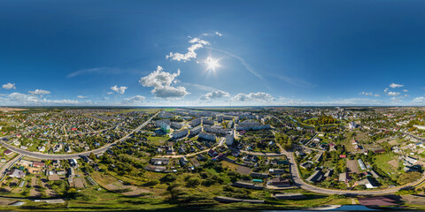 Wall Mural - aerial full seamless spherical hdri 360 panorama view above road junction with traffic in small provincial town with private sector and high-rise apartment buildings in equirectangular projection.