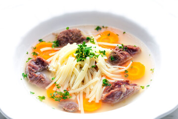 Wall Mural - beef broth with noodles and carrot