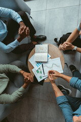 Top view of business partners sitting on meeting and talking about deal