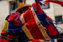 Old Colorful Cloth Of An Ancient Tibetan Buddhist Dancer At Tiji Festival