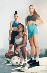 Canvas Print - Team sports, football and portrait of friends standing together with ball on city court outdoors. Woman diversity, sport fitness health and girlfriends empowerment or support before competition match