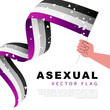 The flag of asexual pride in the hand of a man. Lack of sexual orientation. Sexual identification. A colorful logo of one of the LGBT flags.