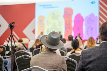 Wall Mural - group of people watching presentation on large screen