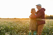 © pikselstock - Senior couple in a field in autumn at sunset