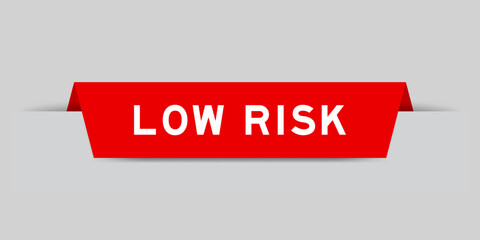 Sticker - Red color inserted label with word low risk on gray background