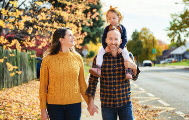 Wall Mural - Great Family having fun in Autumn season with the child girl