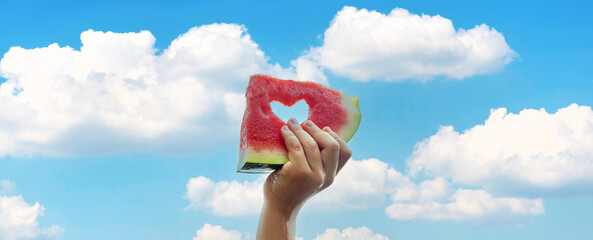 A child on a picnic eats a watermelon. Selective focus.