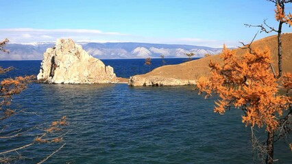 Wall Mural - baikal lake on sunny autumn day. view of natural landmark of olkhon island - shamanka rock or cape b