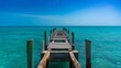Old pier heading out into tranquil waters in Eleuthera, Bahamas