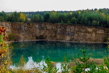 landscape of old stone pit with azure blue water