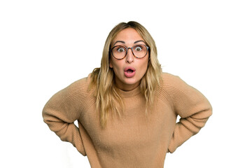 Wall Mural - Young caucasian woman isolated on green chroma background being shocked because of something she has seen.