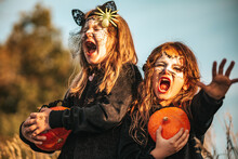 Two Little Girls Dressed As Black Cats Celebrating A Halloween Party