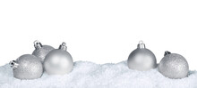Silver Shiny Christmas Balls In Snow Isolated On White Background. Banner