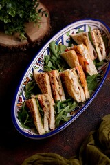 Wall Mural - Plate of mini club sandwich with some spinach