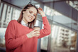 © splitov27 - Cute woman with sunglasses drinks coffee on the background of the business center