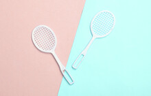 Doll Tennis Rackets On A Blue-pink Pastel Background. Top View