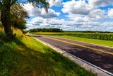 Fototapeta  - American Country Road Side View With Blue Sky