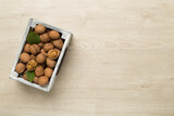 Fototapeta Mapy - Fresh walnuts on wooden background, top view