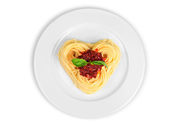 Canvas Print - Cooked spaghetti carefully arranged in a heart shape and topped with tomato sauce accompanied by raw ingredients to the side