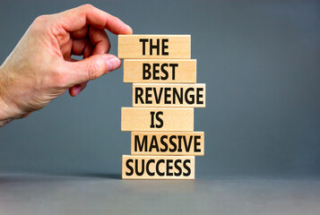 Wall Mural - Revenge or success symbol. Concept words The best revenge is massive success on wooden blocks. Bussinesman hand. Beautiful grey background. Business and revenge or success concept. Copy space.