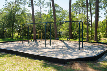 Wall Mural - Swings for baby and small children at a scenic playgorund in Destin Florida