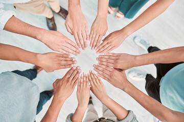 Poster - Hands, collaboration and motivation with a business team standing in a huddle or circle from above. Teamwork, goal and unity with a man and woman employee group together in the office for support