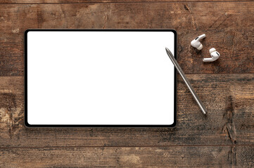 Poster - mockup digital tablet, stylus pen, earphone. Top view mock up digital tablet, stylus pen, earphone on wooden table