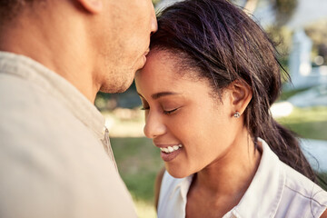 Wall Mural - Couple, love and outdoor park for bonding with a kiss on forehead showing commitment, trust and support with a smile. Happiness, care and nature with a young man and woman in a romantic relationship