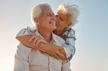 Kiss, Hug And Senior Couple With Love, Care And Happiness In Their Marriage Together In Nature. Happy, Relax And Smile From An Elderly Man And Woman Hugging And Kissing For Gratitude And Commitment