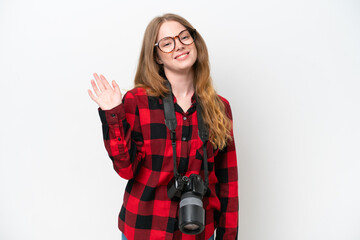 Canvas Print - Young photographer pretty woman isolated on white background saluting with hand with happy expression