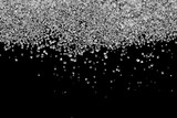 Fototapeta  - Białe kryształy cukru rozsypane na czarnym tle