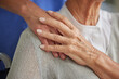 © Beaunitta V W/peopleimages.com - Comfort, hand and nurse with senior for care in wheelchair at house, nursing home or retirement. Zoom, hands and touch on shoulder for compassion, elderly and support for healthcare in disability