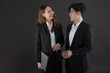 © Naypong Studio - Business men and business women stand to talk business with smiling.