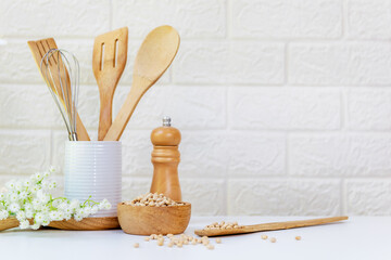 Wall Mural - Kitchen tools and kitchenware utensil object on kitchen shelf wood white for healthy eat and health care life.  Wall white brick background, copy space for text