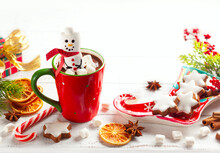 Sweet Christmas Homemade Treats For Festive Party. Hot Chocolate With Marshmallow Snowman, Gingerbread, Candy Cane And Winter Spices. Concept Christmas Homemade Food And Drink.