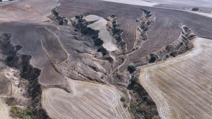 Wall Mural - Ramblas of erosion between crops in Hontanares de Eresma. Aerial view from a drone. Springs of Eresma. Province of Segovia. Castile and Leon. Spain. Europe