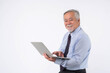 © suphaporn - Asian senior businessman , senior man , old man using laptop computer , smiling feel happy isolated on white background with copy space , concept for senior business success