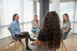 Group of women victims of robbery, violence, infidelity and other bad and negative experiences and crimes on support group psychotherapy with therapist talking about their problems.