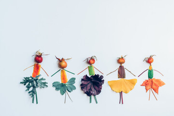 creative figures craft ideas from flowers and colorful autumnal leaves isolated