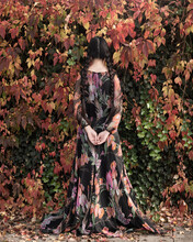 Rear View And Abstract Portrait Of Girl In Floral Dress Hiding Near Wall Of Autumn Foliage
