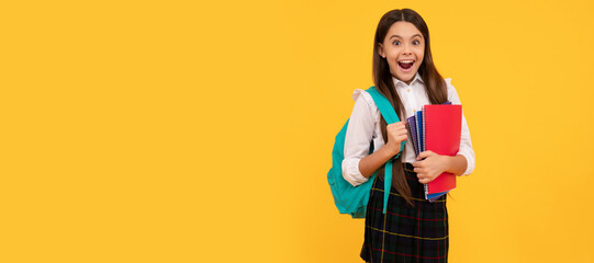 Poster - amazed kid going to do homework. teenager student hold planner notebook. Portrait of schoolgirl student, banner header. School child face isolated panorama background with copy space.