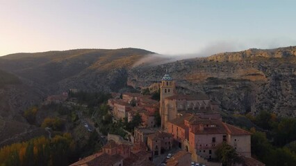 Wall Mural - Views of Albarracin at sunset with its walls and the church of Santa Maria y Santiago.