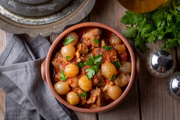 Wall Mural - Traditional Greek dish of beef stifado in a sauce. Meat stew, onion stew. Turkish name; sogan yahni or et yahni