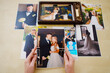 © andrey - printed wedding photos in the hands and in a wooden box with a flash drive.