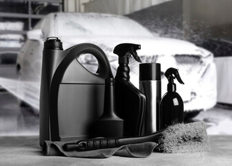 Wall Mural - Cleaning supplies on grey stone surface at car wash