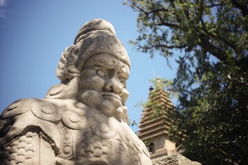 Sticker - Closeup of a carved stone artwork of a funerary monument in Zhenjue temple of Beijing, China