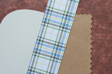 Background With Plain Brown Paper Card And Fancy Border, Blue Plaid Paper, And Card Stock With Rounded Edge